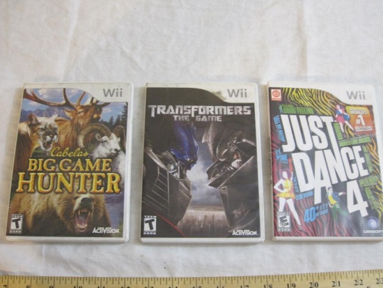 Lot of Wii Games including Just Dance 4, Transformers the Game, and Cabela's Big Game Hunter, all