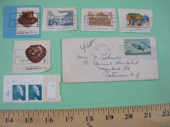 Lot of mostly canceled US postage stamps, including 2 13 cent Pueblo Art stamps, 3 cent Wildlife