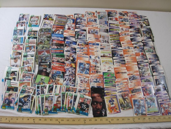 Large Lot of Assorted NFL Football Trading Cards including Jarvis Williams, William Perry, Reggie