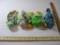 Four TY Beanie Babies including Rainbow (2 variations), Iggy, and Smoochy, all tags included and