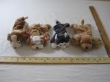 Four Dog TY Beanie Babies including Nanook, Wrinkles, Spunky, and Tracker, all tags included and