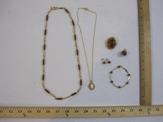 Lot of Gold Tone Jewelry including Sunstone pendant, bracelet, and earring set and Cameo pendant and