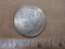 One 1928 Silver Peace Dollar, 26.7 g