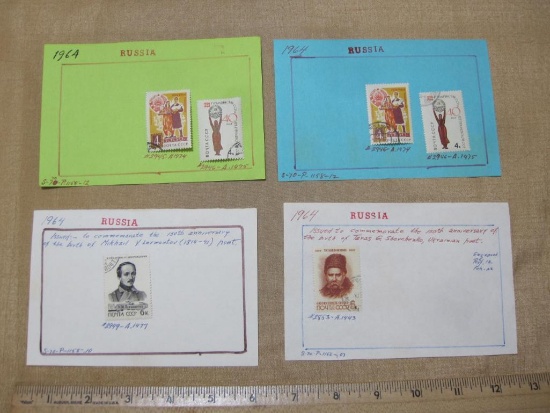 Six canceled 1964 Russia postage stamps, mounted on four sheets. They include ones issued to