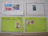 Lot of 12 canceled Romania stamps mounted on 4 small sheets of paper. They include 8 1974 postage