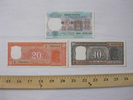 Three Notes of Reserve Bank of India Paper Currency including five rupees (has staple holes), 10