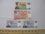 Four Paper Currency Notes from Singapore including one dollar, five dollars, and ten dollars