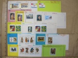 Lot of 25 uncanceled Rwanda postage stamps from 1969 through 1972. They are affixed at the top to