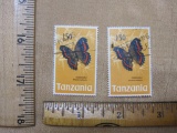 Two canceled 1973 Tanzania stamps featuring a butterfly and the words 