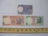 Three Notes of Reserve Bank of India Paper Currency including one rupee (has staple holes), five