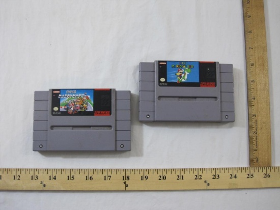 Two Super Nintendo Mario Game Cartridges including Super Mario World and Super Mario Kart, games