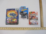 Three Sealed Cars including Matchbox Hummer Ultimate Rescue, Hot Wheels BMW 2002, and Mid-Light