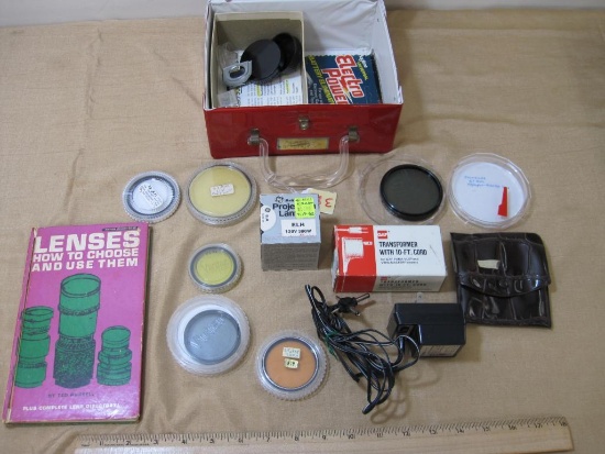Vintage Box of Assorted Camera Equipment includes lenses, cords, and more