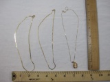 Three 14 KT Gold Necklaces (6.2 g combined) and 10 Kt Esemco Cameo Pendant (1.3 g pendant weight)