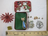 Assorted Christmas Jewelry including earrings, pins, and snowman tin, 5 oz