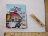 Two Train Items including Metro North Railroad wooden train whistle and Lionel Trains Keychain with