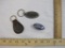 Three Vintage Car Items including Oldsmobile key chain, Ford emblem, and J and J Truck Bodies