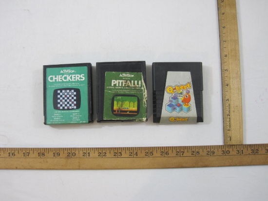 Three ATARI Game Cartridges including Q*bert, Pitfall!, and Checkers, games have been tested and