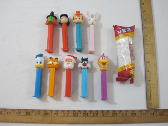 Lot of Assorted PEZ Dispensers including Santa, Sylvester, Pebbles Flintstone, Garfield and more, 8