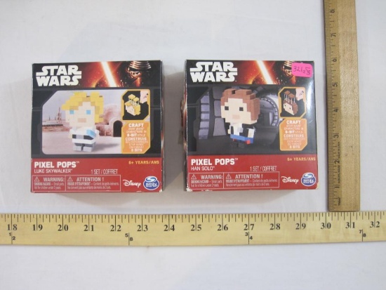 Two Star Wars Pixel Pops Figures including Luke Skywalker and Han Solo, in original boxes, 6 oz