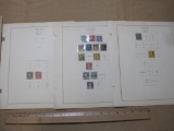 Early US postage stamps, from 1916-1919,on display pages. They include George Washington 1 cent