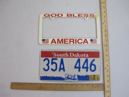 South Dakota Metal Embossed License Plate 35A 446 with plastic God Bless America plate holder, 10 oz