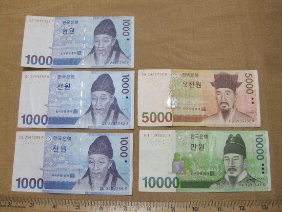 Five Bank of Korea Notes, three 1000 Won, 5000 Won and 10000 Won Bills, circulated