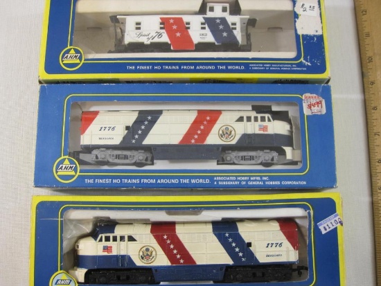 Three AHM HO Scale Train Cars including Spirit of '76 FM Locomotive and Dummy A and 5340P Caboose,