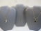 Three Gold Tone Necklaces with Black Pendants including Roget and more, 2 oz