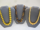 Three Yellow and Brown Beaded Necklaces, 7 oz