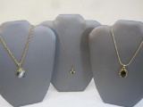 Three Gold Tone Necklaces with Black Pendants including Roget and more, 2 oz