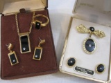 Lot of Gold Tone Black and Clear Gemstone Accented Jewelry including Avon necklace, earring and pin
