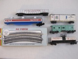 Lot of HO Scale Train Cars and AHM Track including cars marked made in Austria, Lima Italy and Hong