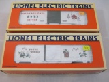 Two Lionel Christmas Boxcars including Lionel Christmas Boxcar 1995 6-19938 and 1993 O Gauge