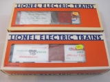 Two Lionel Christmas Boxcars 1986 Lionel Christmas Car 6-9491 and 1987 Lionel Christmas Car 6-19903,
