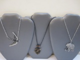 Three Vintage Animal Necklaces including elephant, turtles, and bird, 2 oz