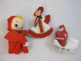 Three Vintage Christmas Items including molded plastic Santa and sleigh, Japan knee hugging elf, and