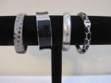 Four Black and Silver Tone Hinged Bangle Bracelets, 6 oz