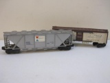 Two Lionel Postwar O Scale Train Cars including Santa Fe SFRD 6672 Reefer and Alcoa Aluminum 634656
