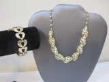Two Gold Tone Jewelry Pieces including 1 necklace and Monet bracelet, 3 oz