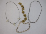 Four Unique Jewelry Items including dainty gold tone flower bracelet, mother of pearl bird necklace