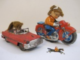 Two Vintage Tin Friction Toys including 1950s Haji Tin Friction Motorcycle with Female Rider and