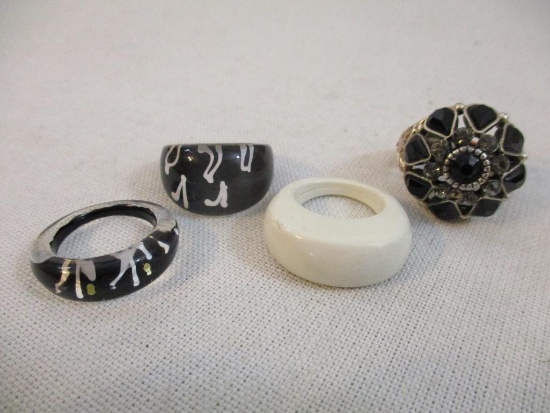Four Rings including 3 acrylic and one stretch with black beads and rhinestones, 1 oz