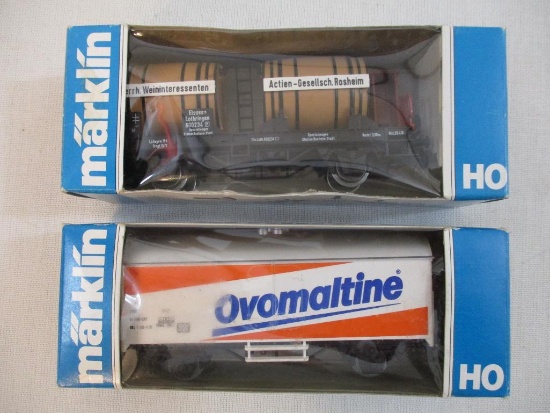 Two Marklin HO Scale Train Cars including 4432 Flat Car with 2 Keg Load and 4428 Ovomaltine Reefer,