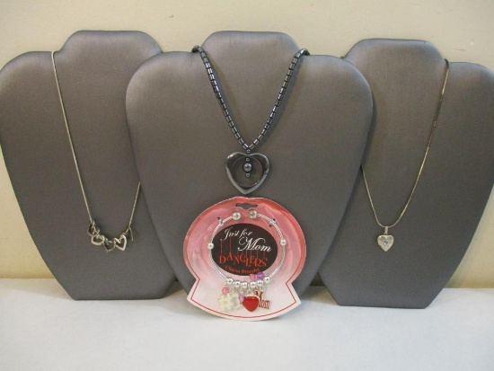 Four Heart Jewelry Items including mom charm bracelet and three heart pendants with necklaces, 3 oz