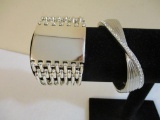 Two Silver Tone Bracelets including clamshell with rhinestones, 4 oz