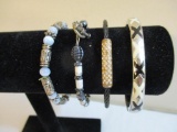 Four Bracelets including X's clamshell bangle, blue beaded and more, 3 oz