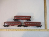 Three Lionel Postwar O Scale Illuminated Pullman Cars including two-2442 Passenger Cars and 2443