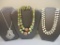Three Vintage Necklaces including Trifari, Monet, and marbled beaded necklace and clip-on earring