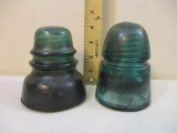 Two Vintage Green Glass Railroad Insulators, 1 marked Hemingray, other is stamped with 13 on top and